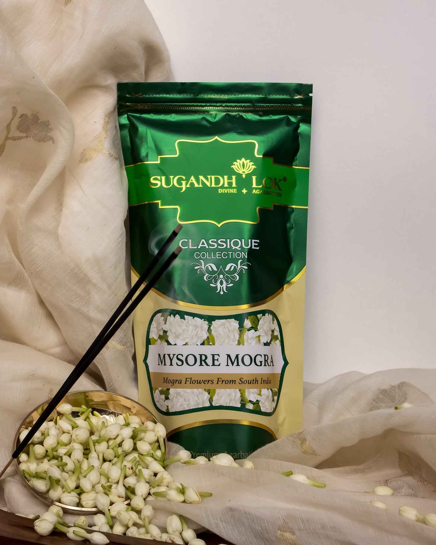 Mysore Mogra Agarbatti Pouch surrounded by mogra flowers