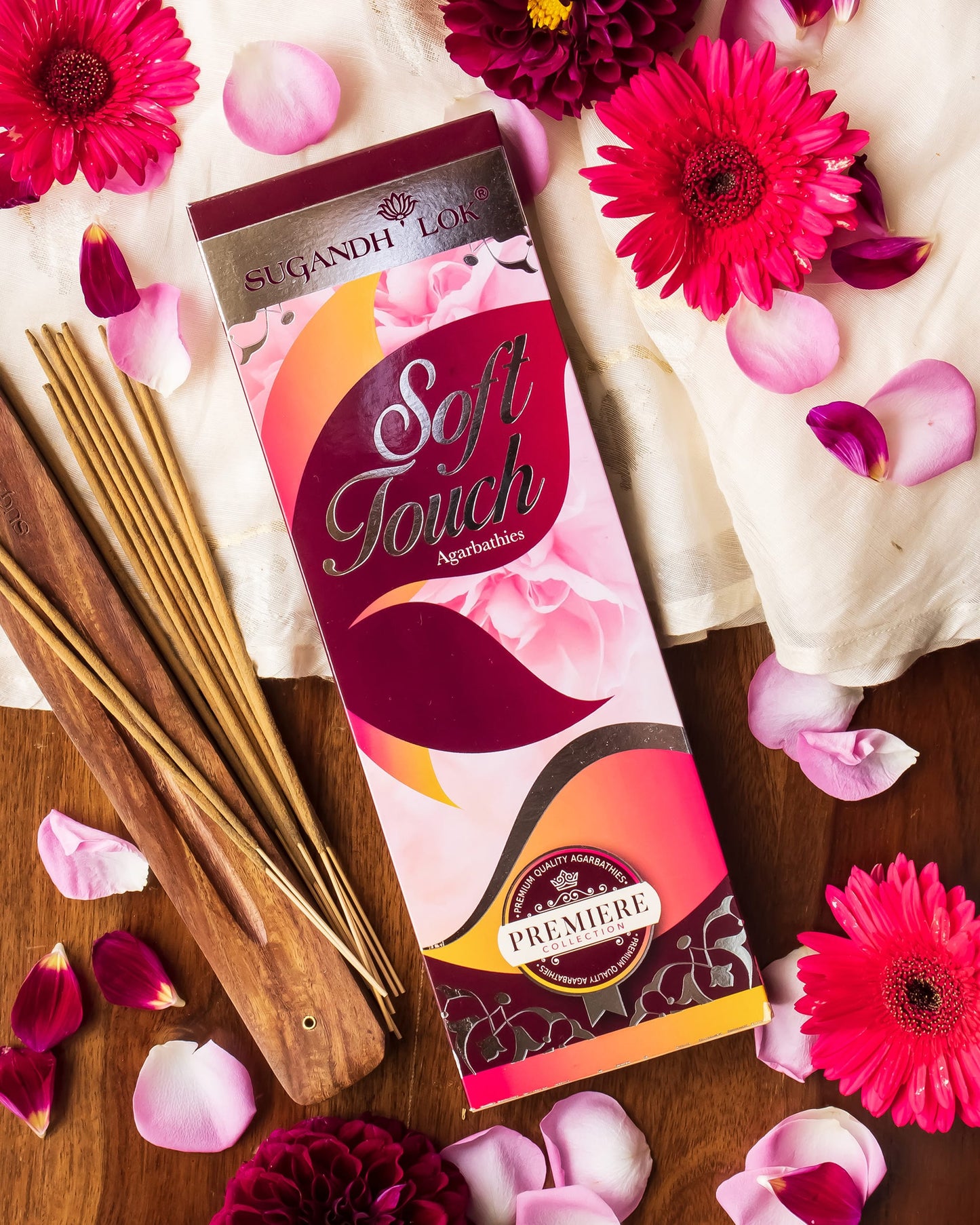 Soft Touch Agarbatti Pack surrounded by petals and flowers