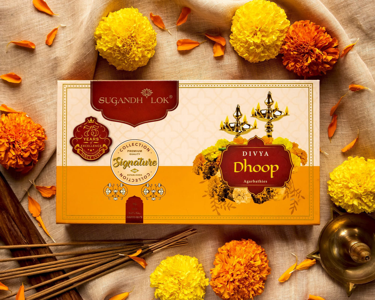 Divya Dhoop Agarbatti Box surrounded by flowers