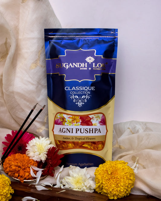 Agni Pushpa Agarbatti Pouch surrounded by flowers and petals