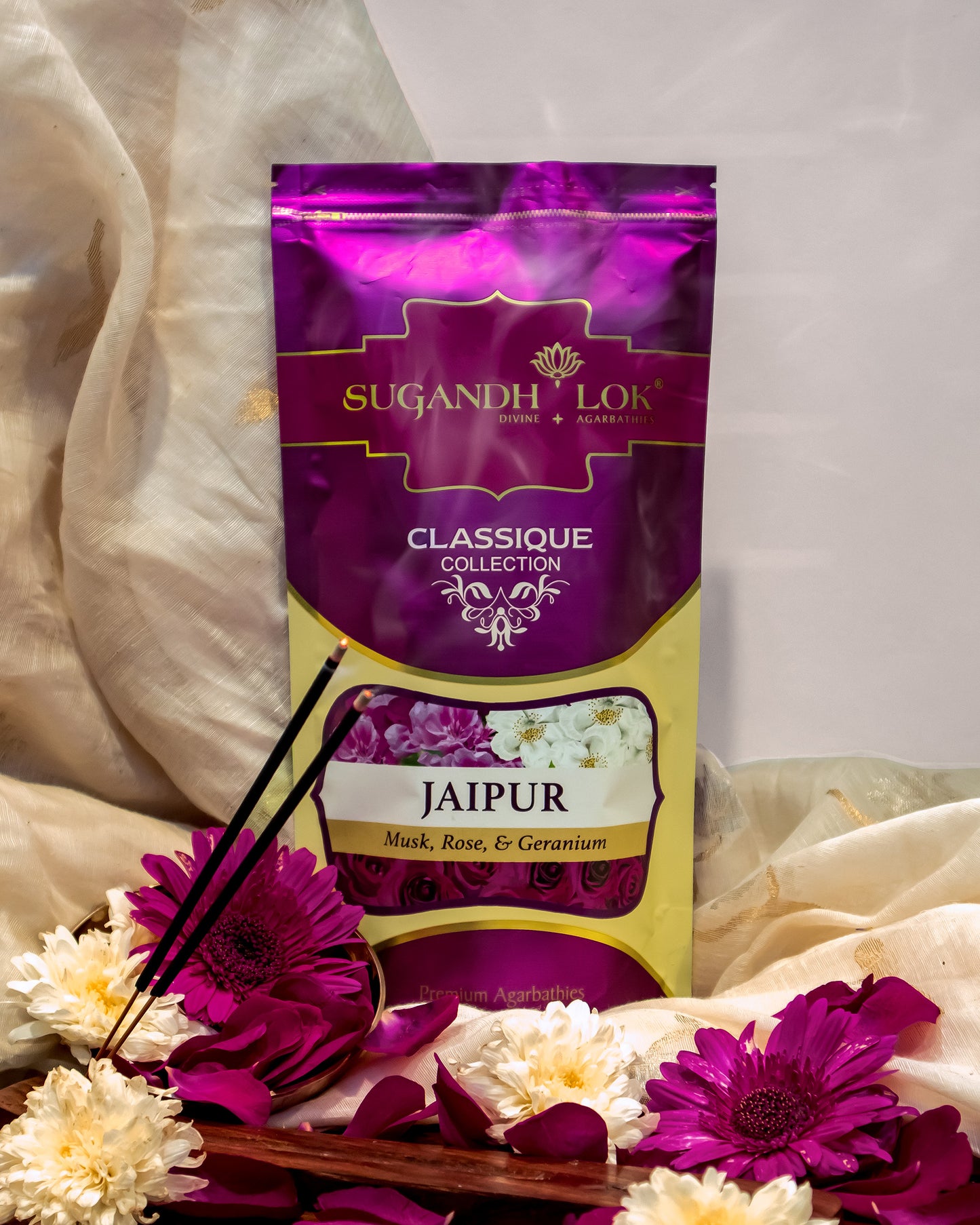 Front of Jaipur Agarbatti Pouch surrounded by flowers