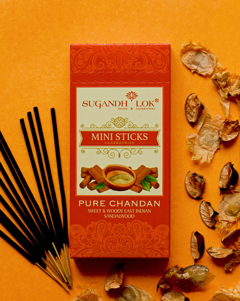 Pure Chandan Agarbatti Mini Sticks Pack surrounded by chandan