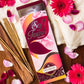 Soft Touch Agarbatti Pack surrounded by petals and flowers