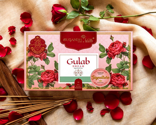Front of Gulab Dream Agarbatti Box surrounded by rose petals